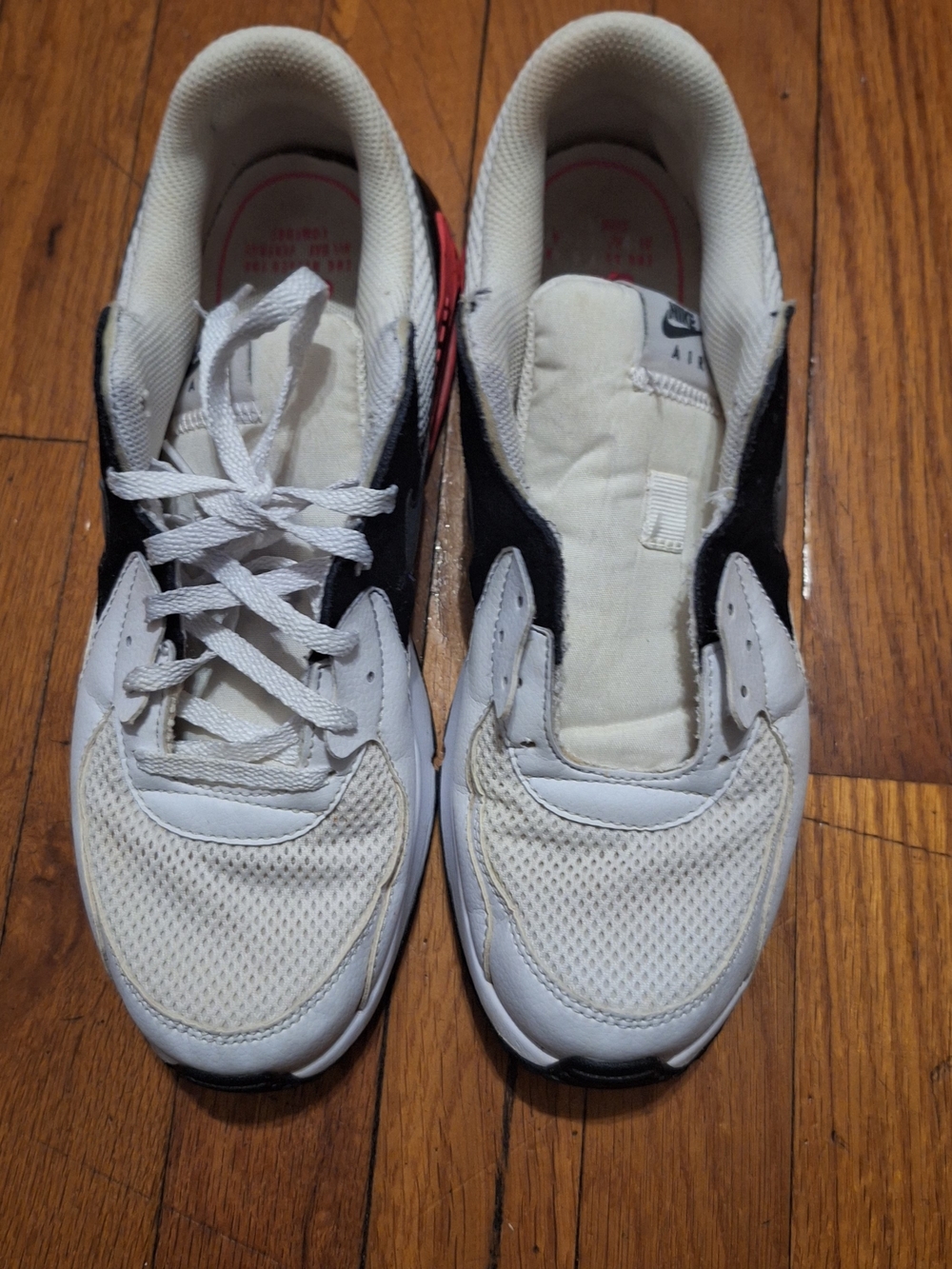 Nike Women's White and Black Athletic Sneakers with Pink Heel Detail